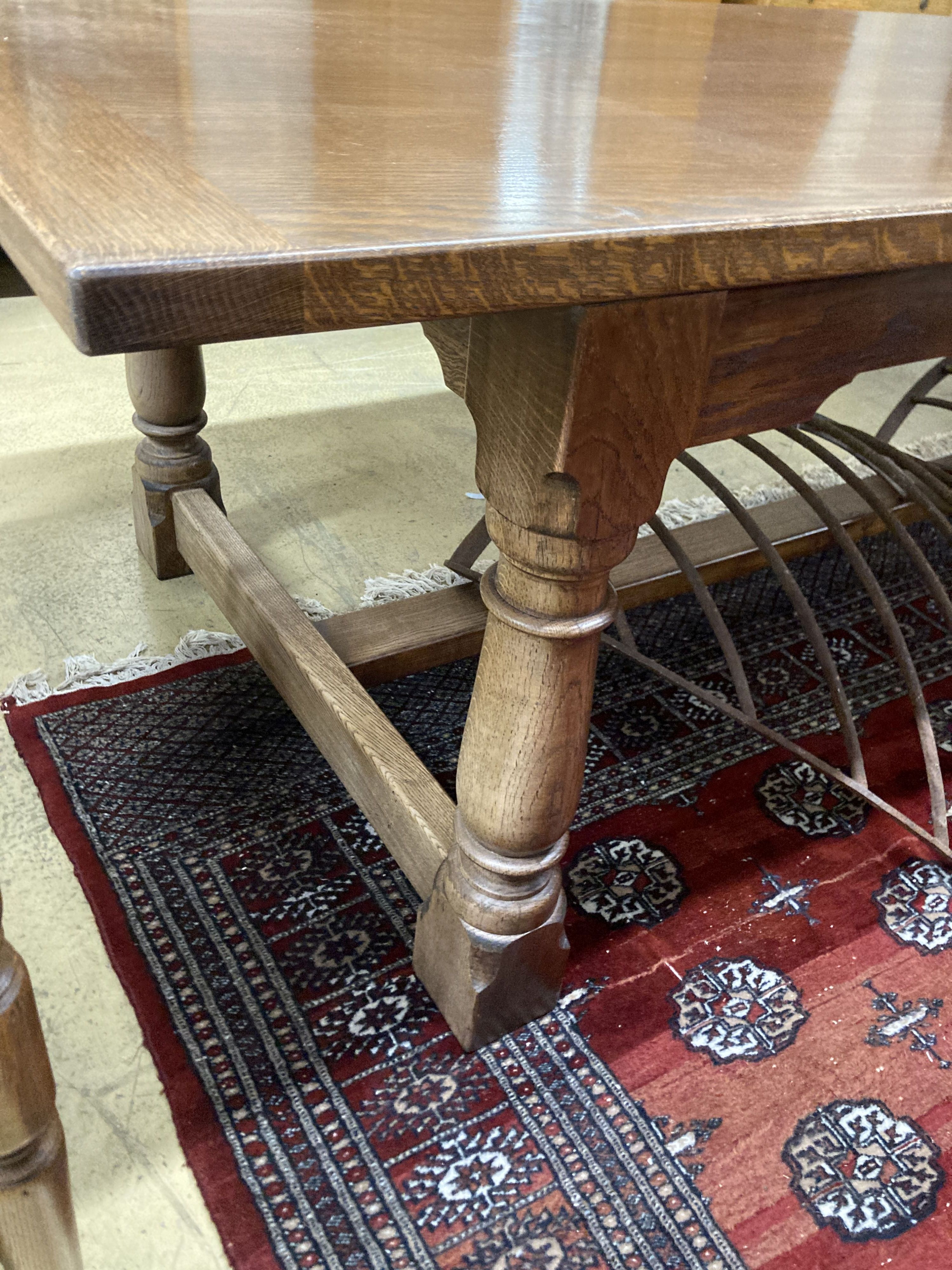 An 18th century style oak rectangular refectory dining table, length 277cm, width 109cm, height 76cm